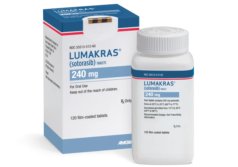 A white bottle of Lumakras tablets labeled 240 mg is placed in front of its box packaging. The design is blue, red, and white
